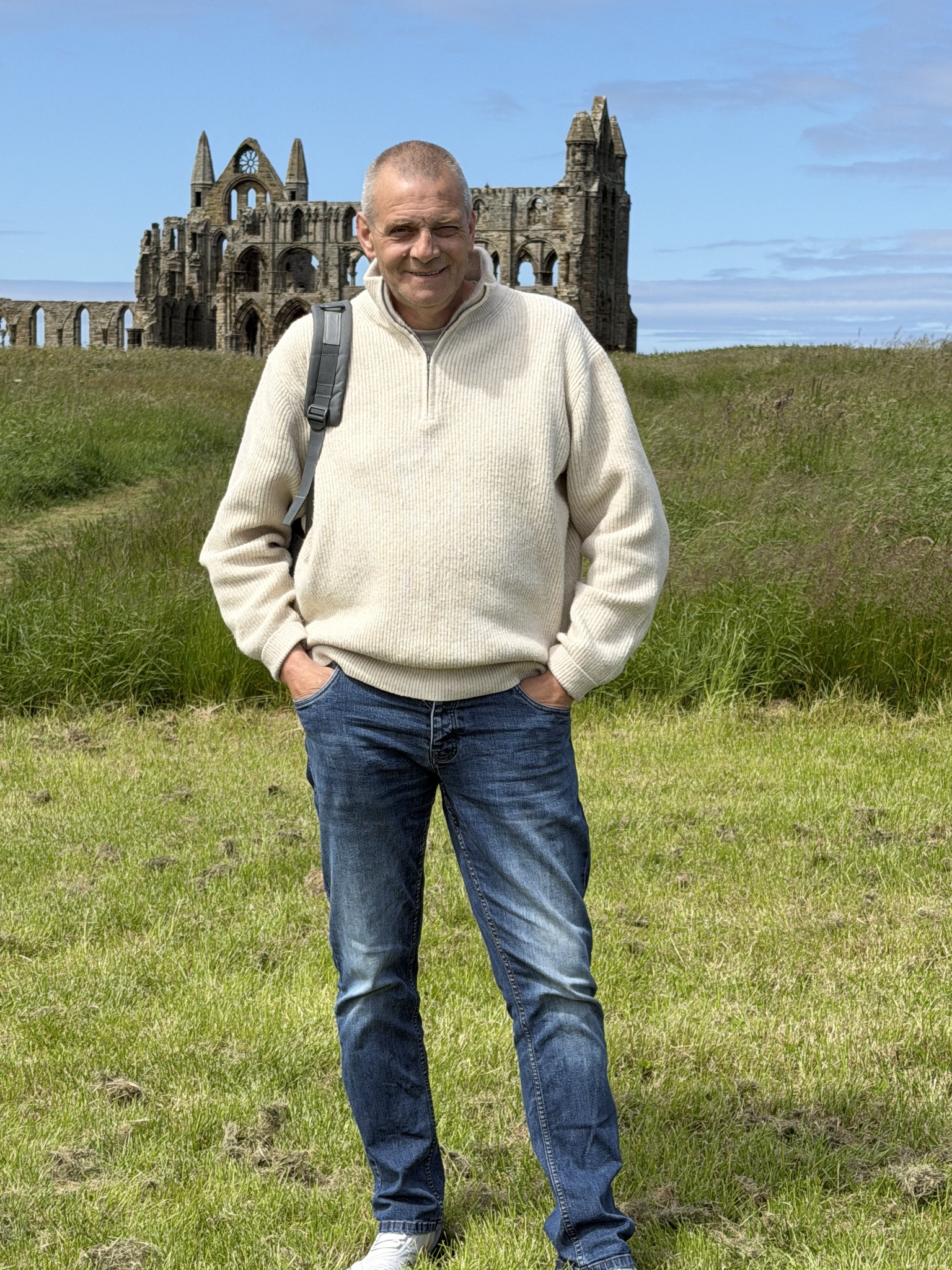 Darren Valsler standing in front of Whitby Abbey